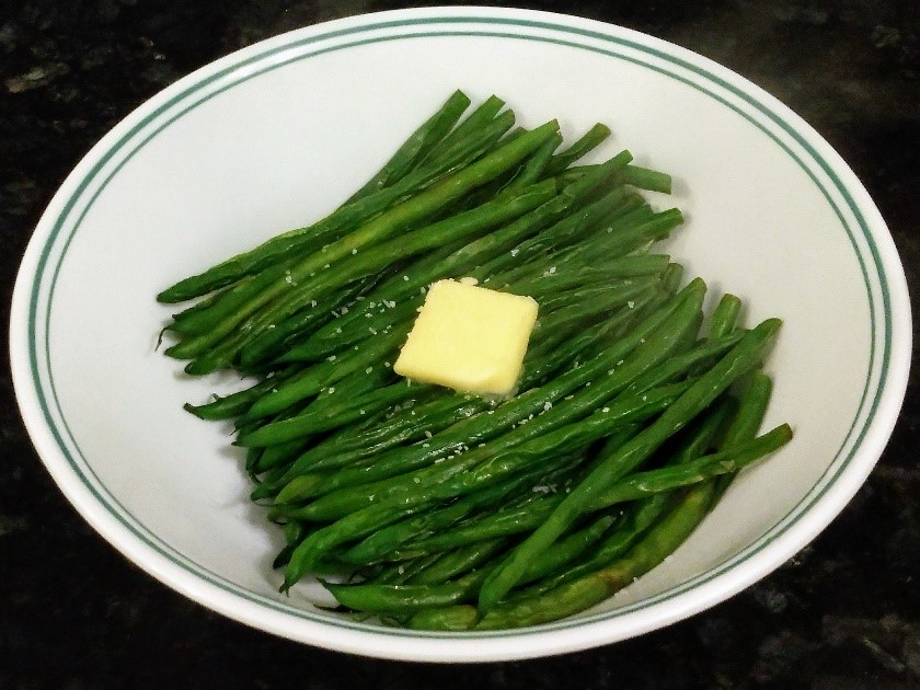 green beans on plate with butter